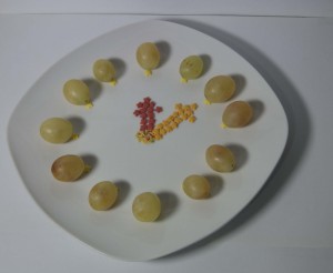 Reloj formado por uvas